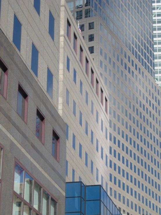 two buildings next to each other in front of a blue building