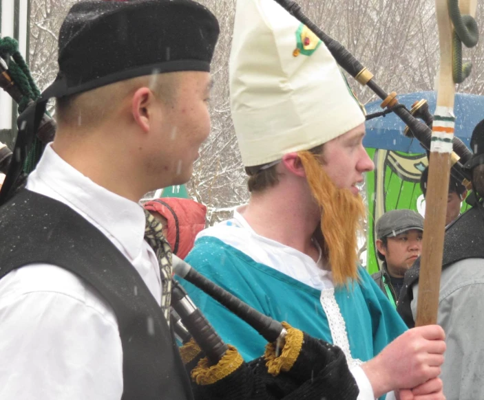 two men in medieval clothing standing next to each other