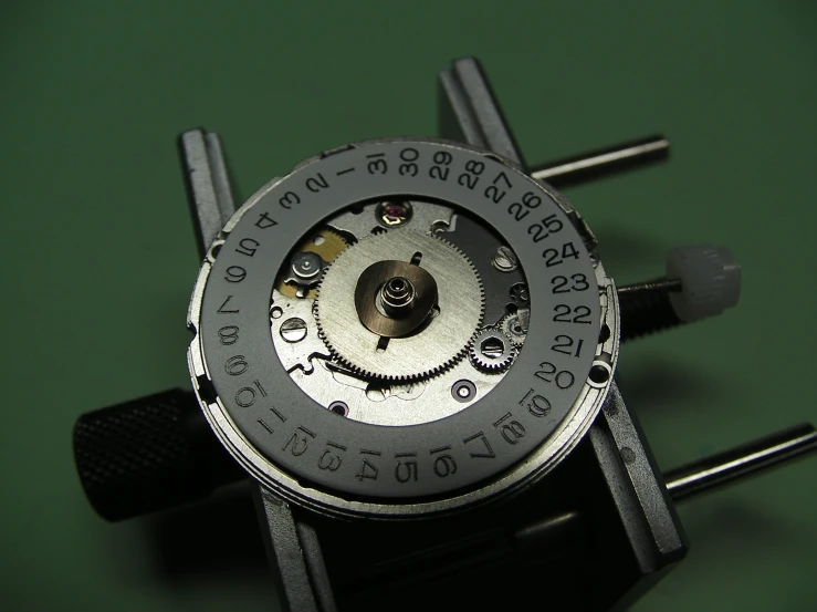 the back side of a watch showing numbers