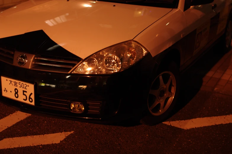 a black and white car on a street