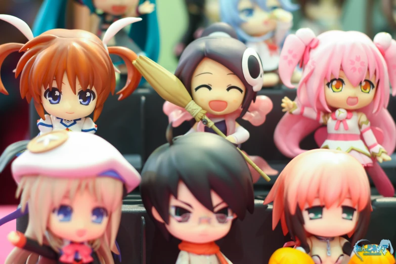 the group of anime dolls is all wearing pink and purple