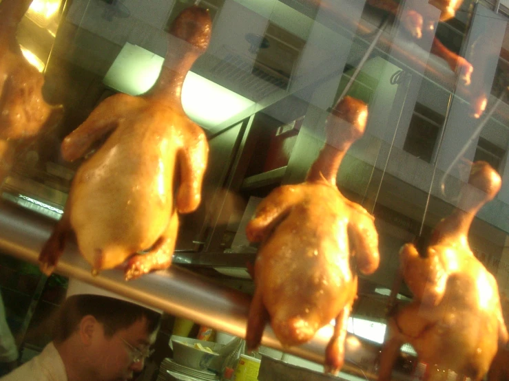 a chicken being cooked at a cooking station