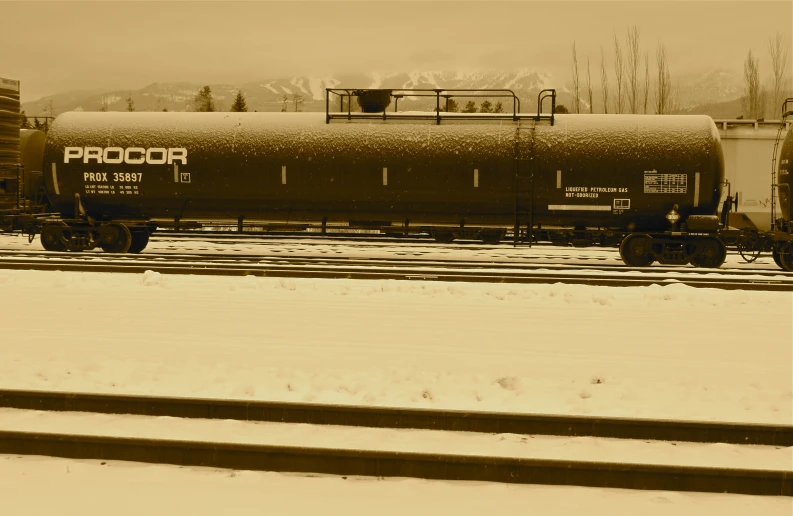 a train sitting on the tracks in the snow
