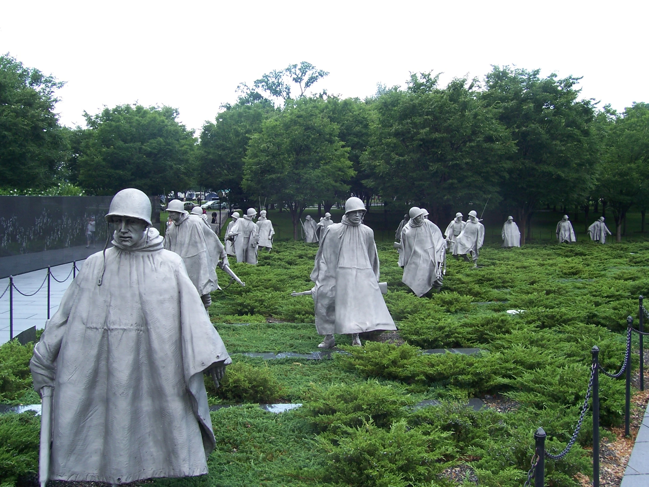 many statues of knights are in the grass