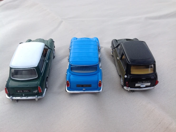 three toy cars on the bed ready to go