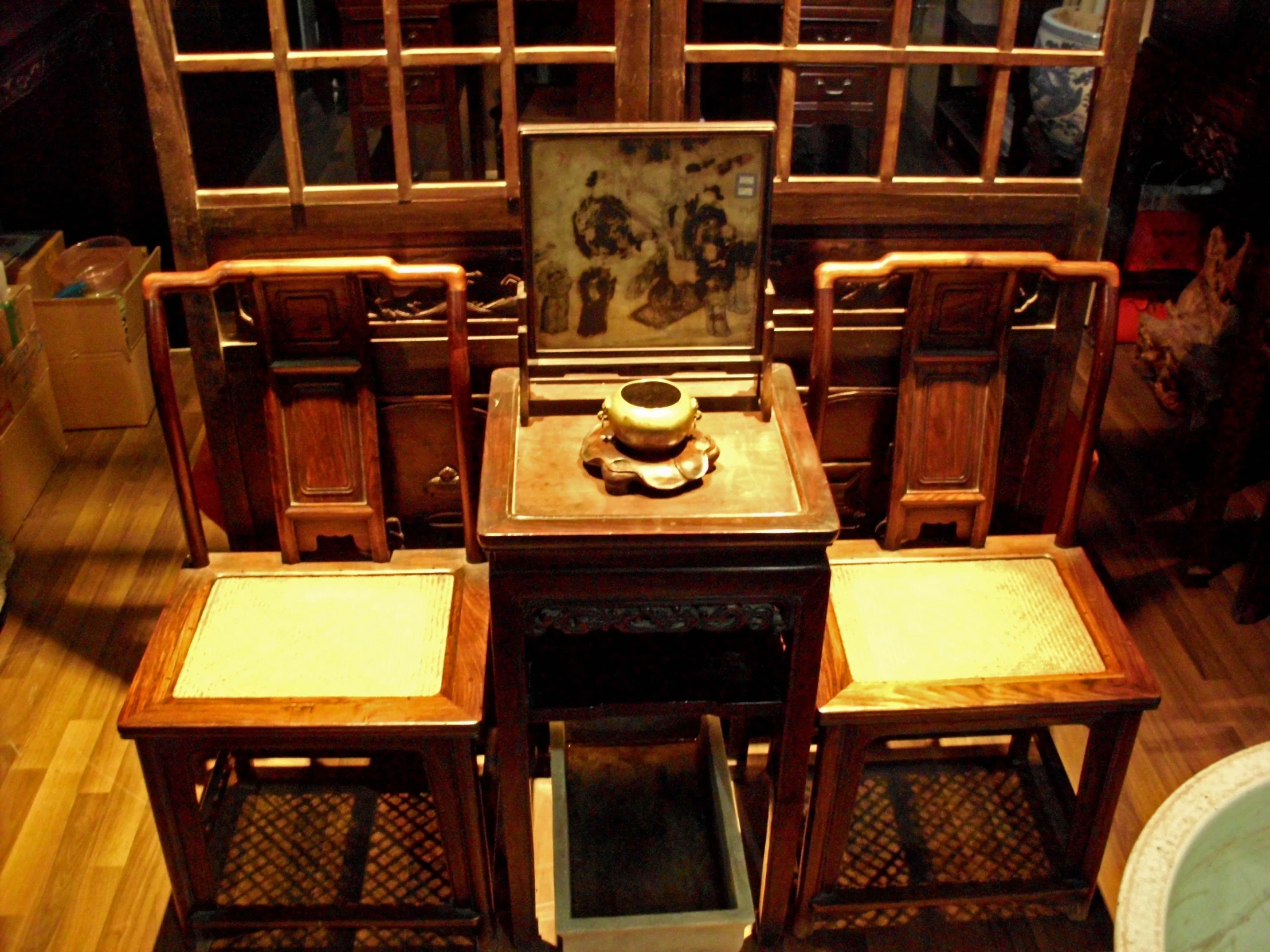 four wooden chairs and table and one chair with a tray on top