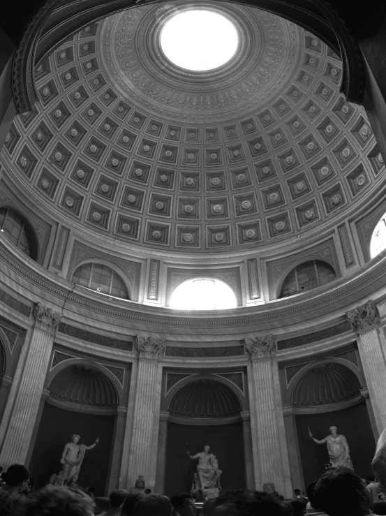 a large dome with statues inside of it