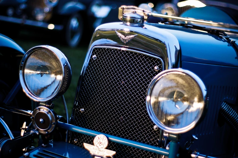 a row of vintage cars parked next to each other