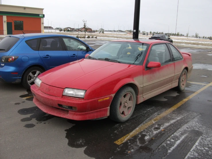 a couple of cars parked in a lot