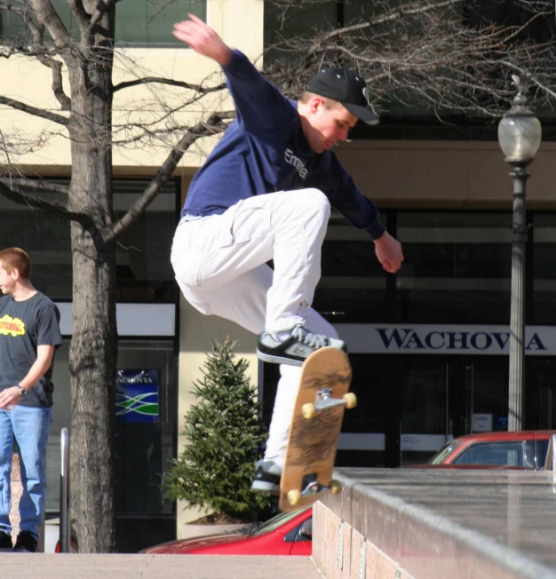 a person on a skateboard does a trick in front of a crowd