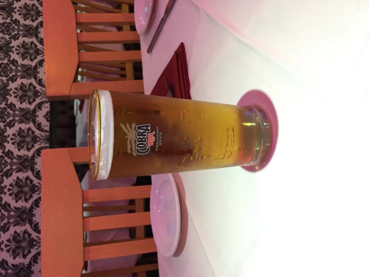 a full beer cup sitting on top of a table