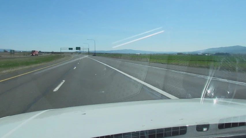 the view from inside a car driving down the road