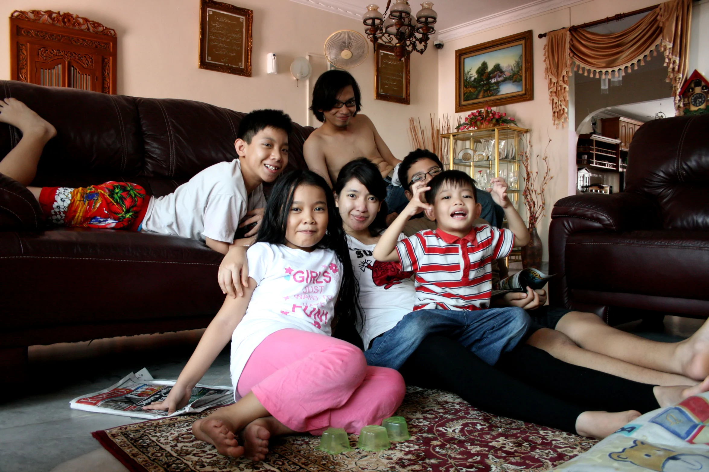 a family posing for a picture in their living room