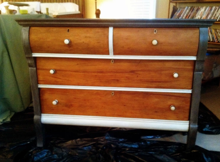 a chest with several drawers that have four drawers on top
