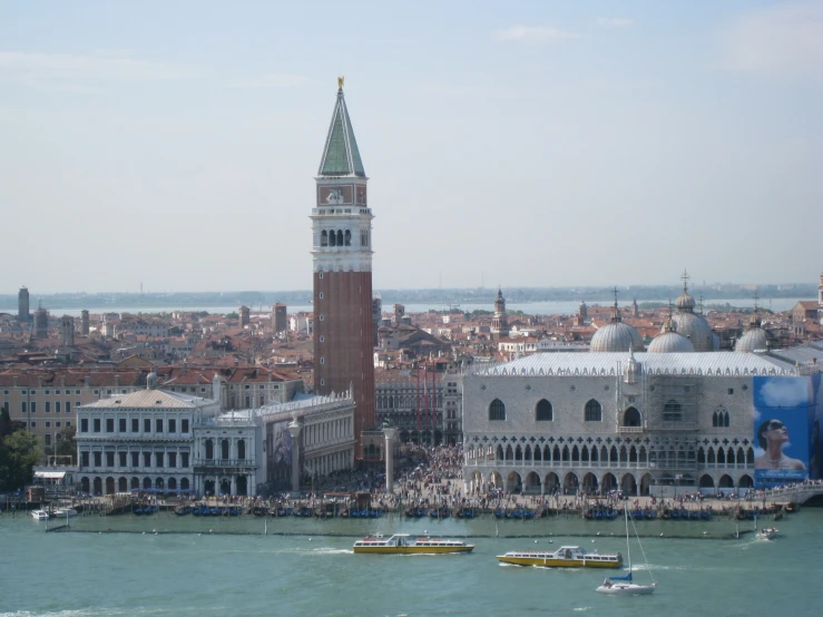 a clock tower next to a city skyline in an old po