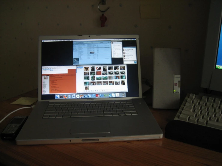 an open laptop computer sitting on top of a desk