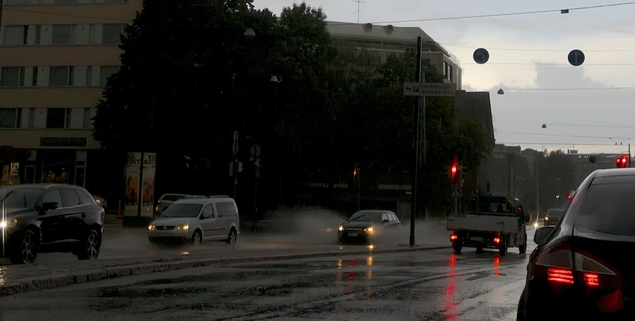 cars on the road with their lights turned red at night