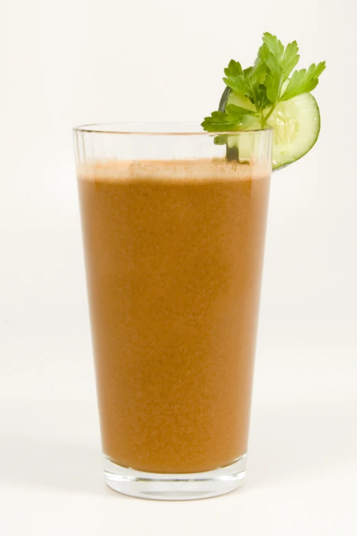 cucumber and slice of cucumber placed in a glass