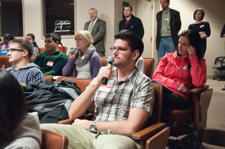 an image of a group of people at a public meeting