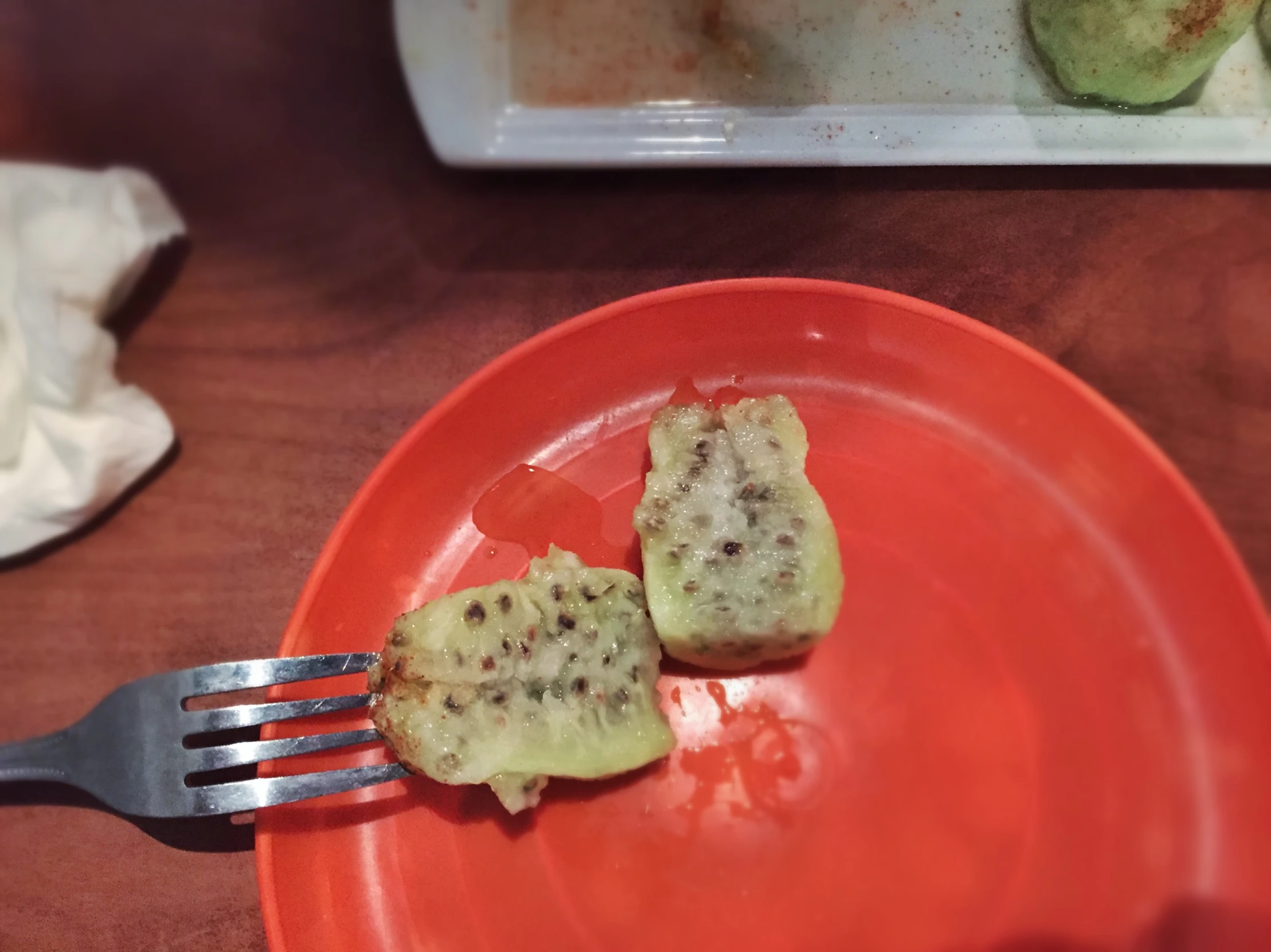 two slices of bread with seeds cut off sitting on a plate