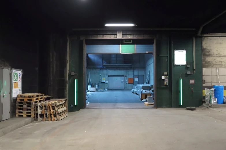 an underground industrial building is lit up at night