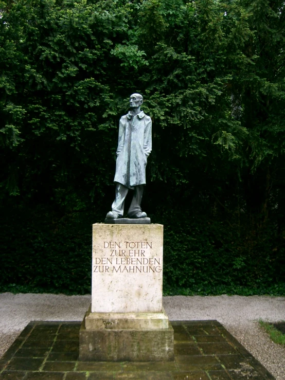 a statue in front of trees with the caption'temple of earth '