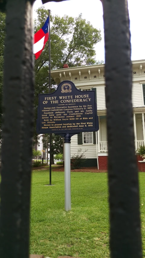 there is a flag flying near the sign