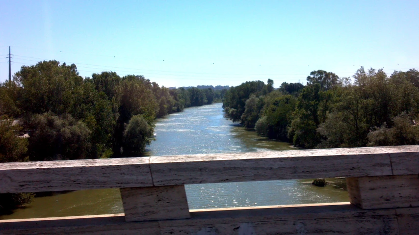 a view over the river with trees to the side