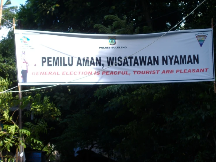 sign that reads pemula amn, wastawn nyaman