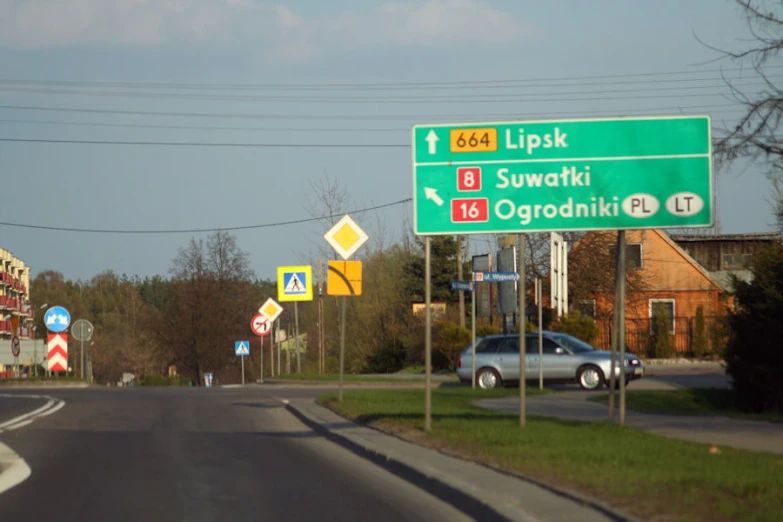 an image of a street sign with a lot of other signs