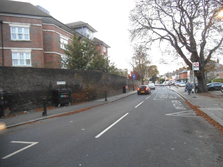 a street scene with a car parked on the side