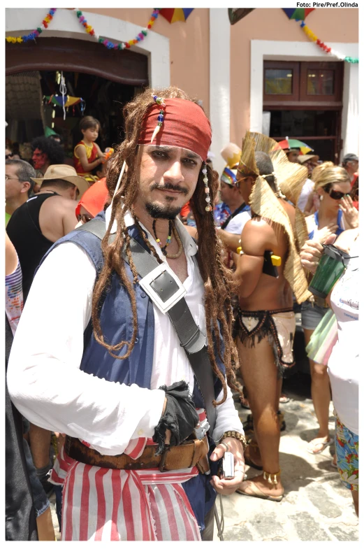 a young man dressed in pirates clothing is looking to his left