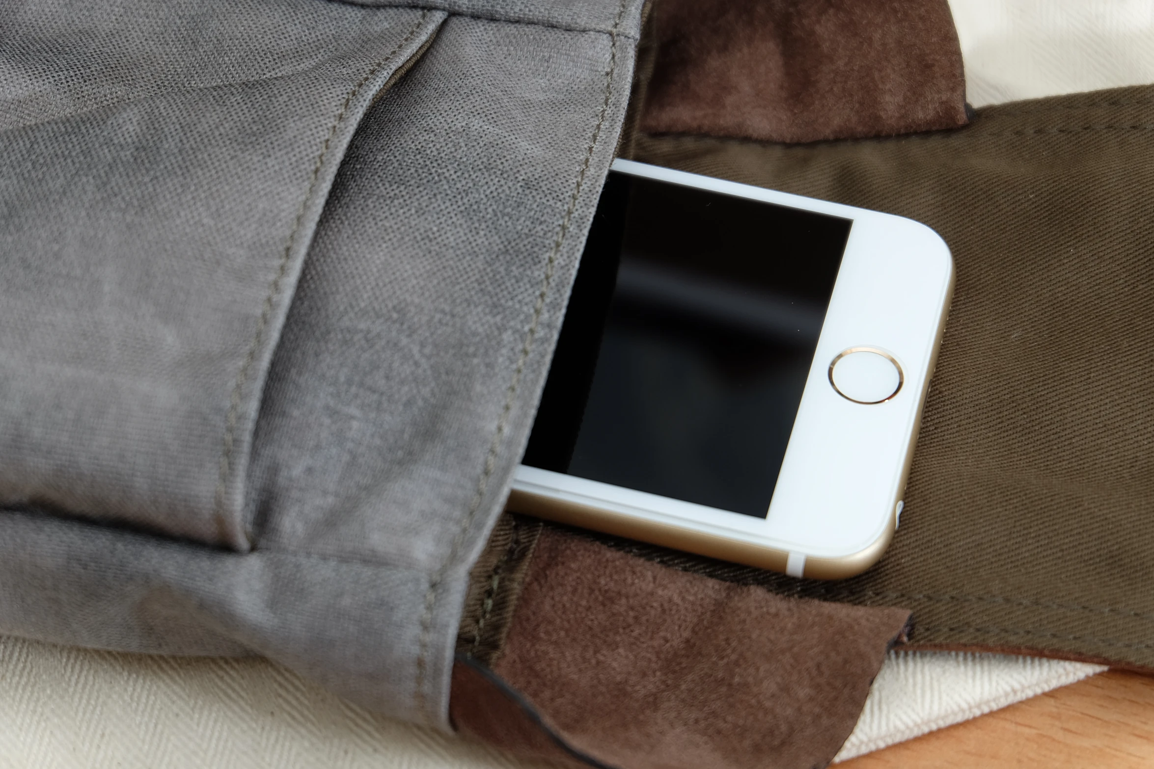 a phone in a bag sitting on the ground