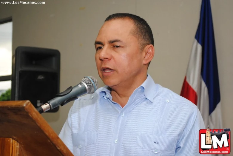 a man standing in front of a microphone