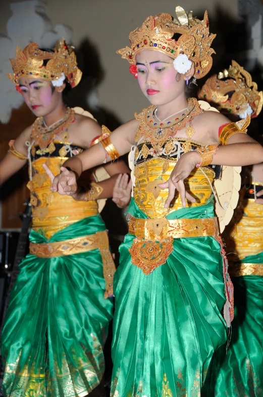 two women dressed in elaborate thai costumes