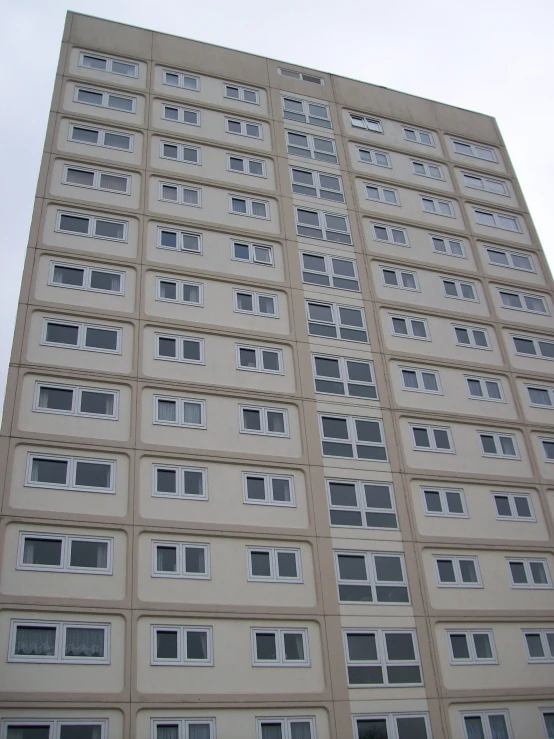 a tall building with many windows in the front