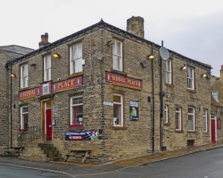 an old stone brick building with many windows