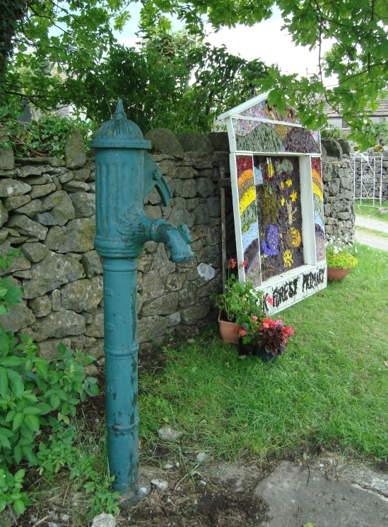 a potted plant sitting next to a fire hydrant