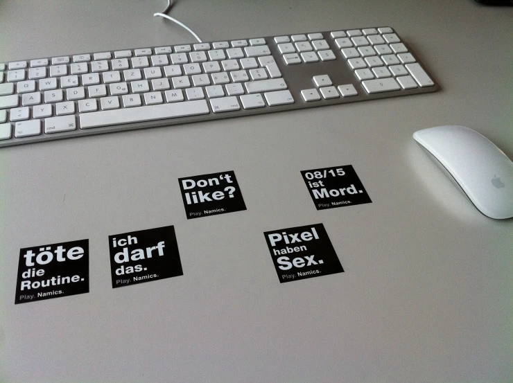 stickers on the side of a computer keyboard