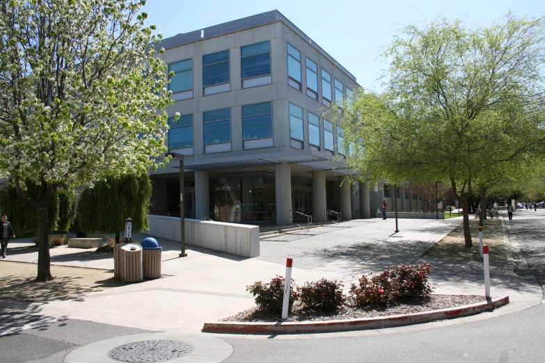 an image of a building with people walking around it