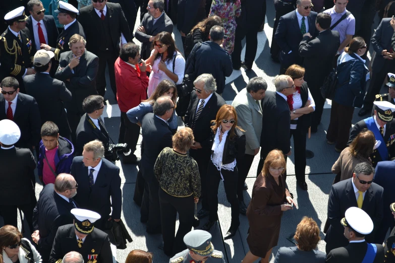 a group of people are standing together with many suits on