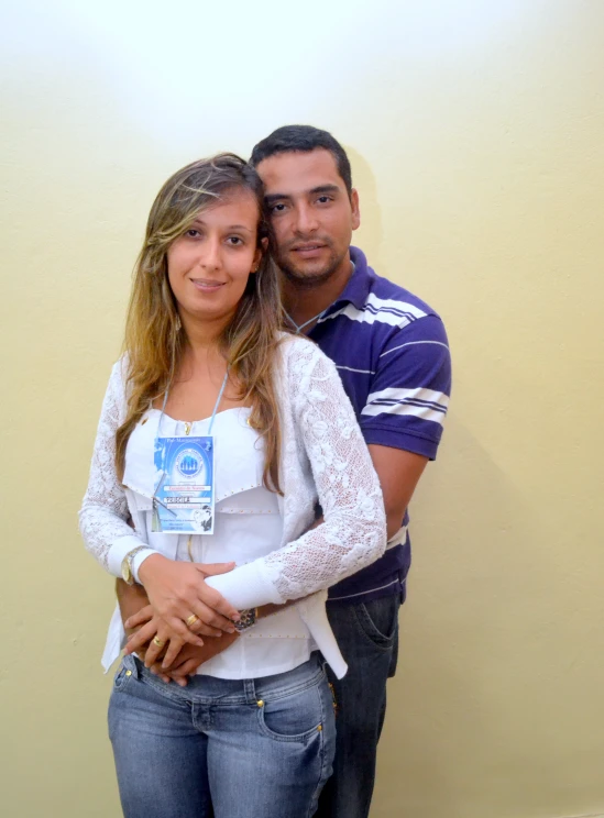 two people pose for the camera in their white and blue clothes