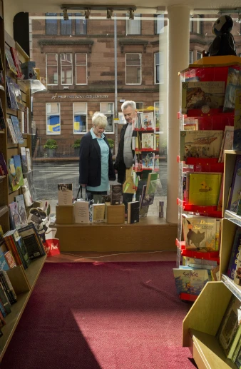 two older women looking at the books on display