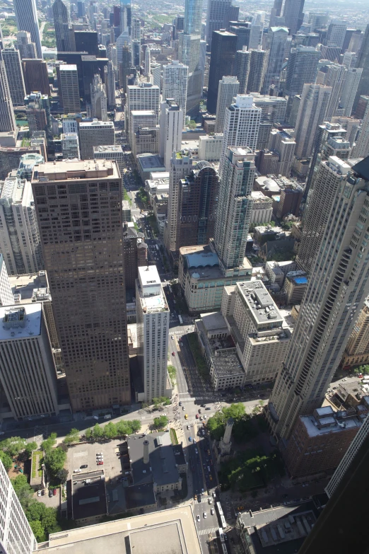 an aerial view of some tall buildings in a big city