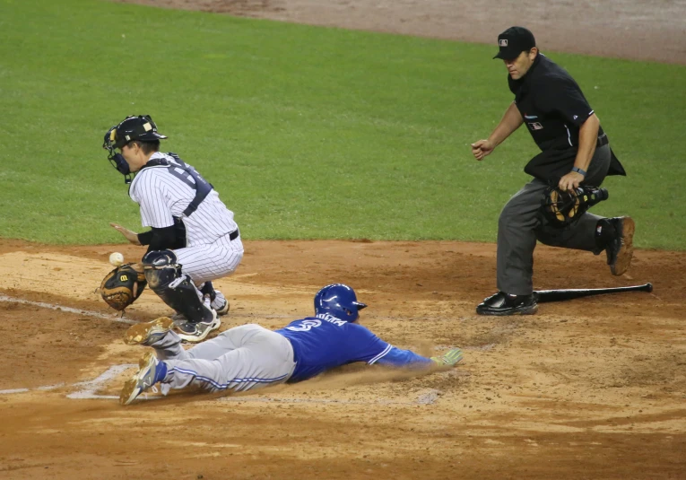 the baseball player is falling after the ball