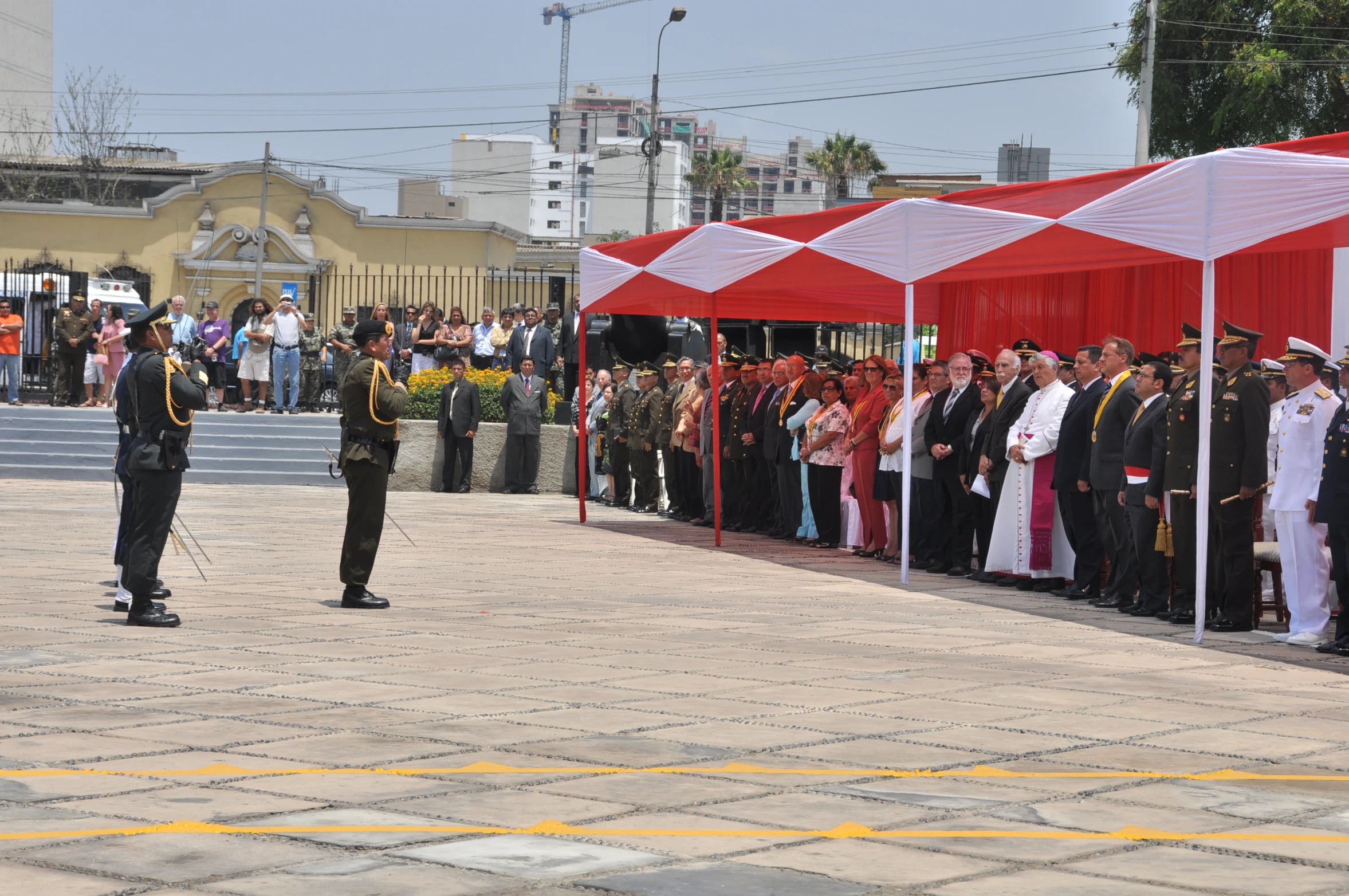 military men standing in front of a line of tented tents