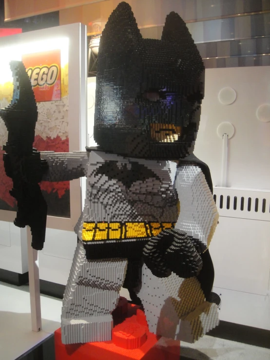 a small lego batman is on display in a toy shop