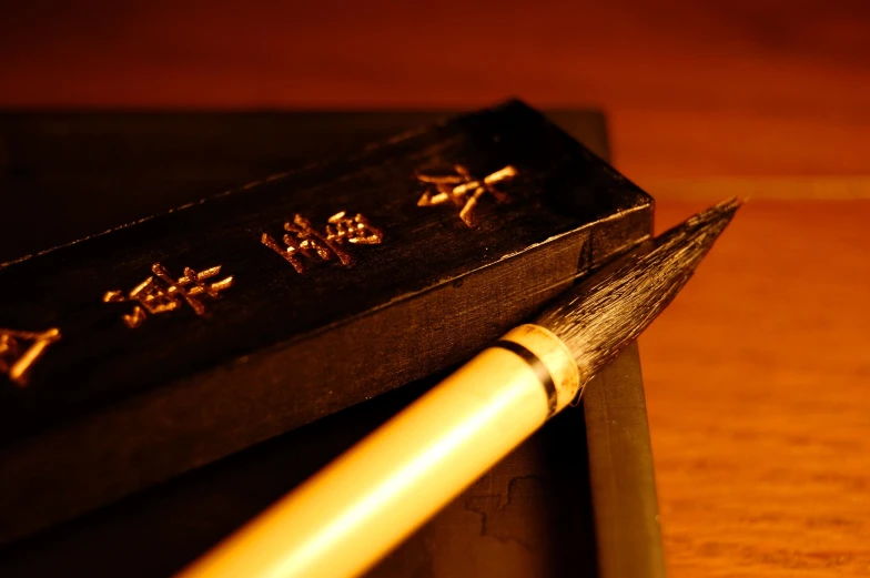 a pencil that is sitting on a desk