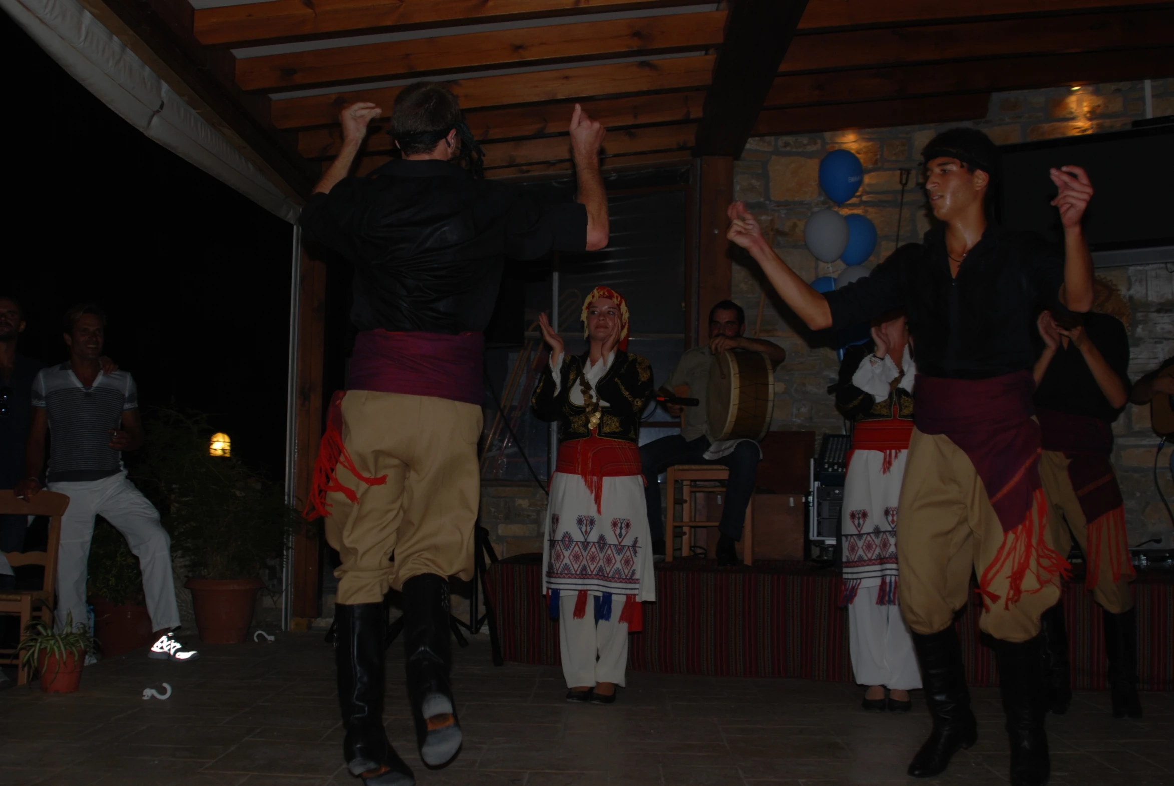 a pair of people doing an acrobatic dance together