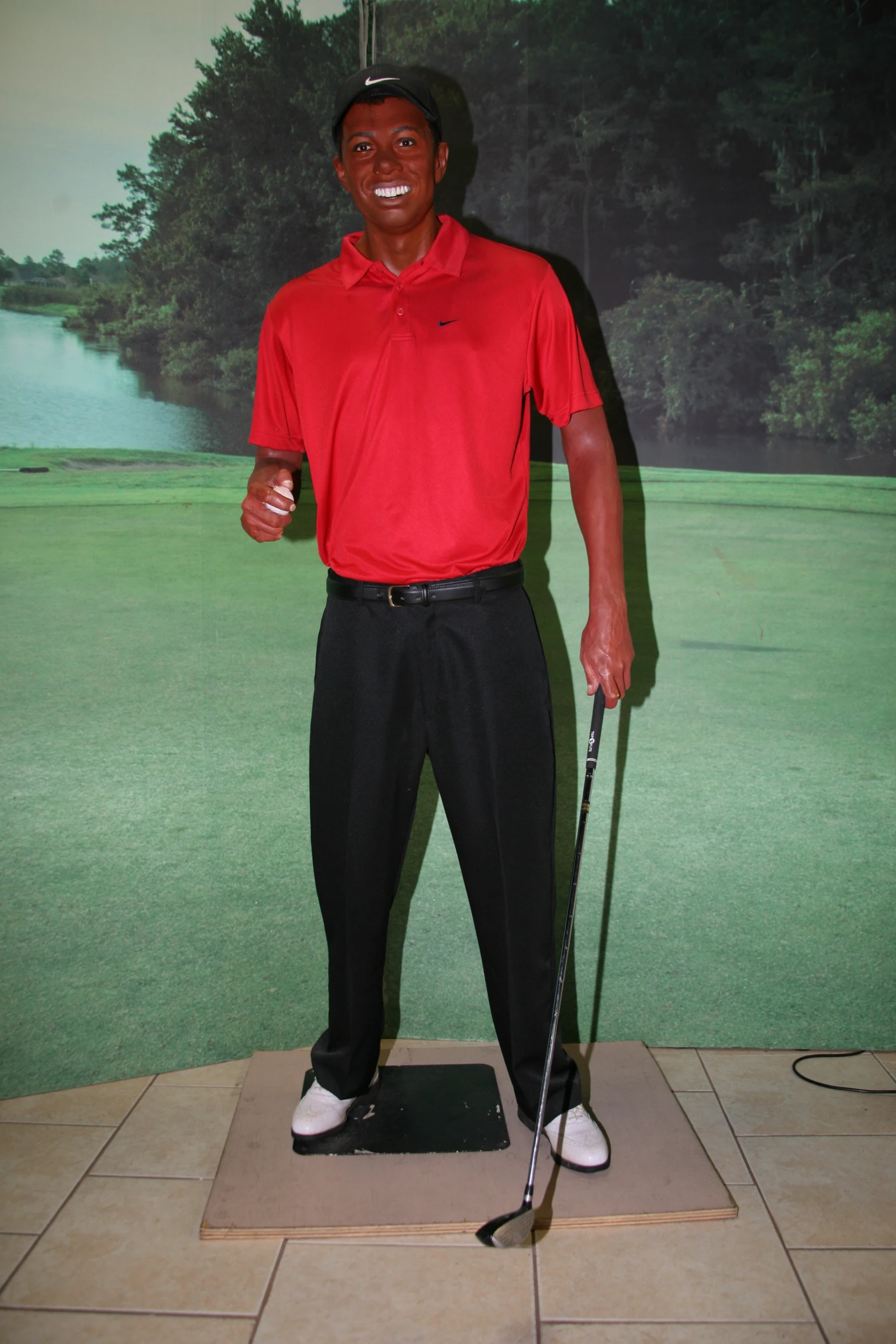 a golf player in a room with golf putting putts